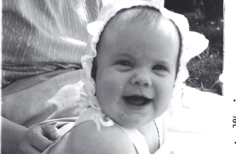 Peggy Rasmussen's daughter, Anne, smiling as a baby