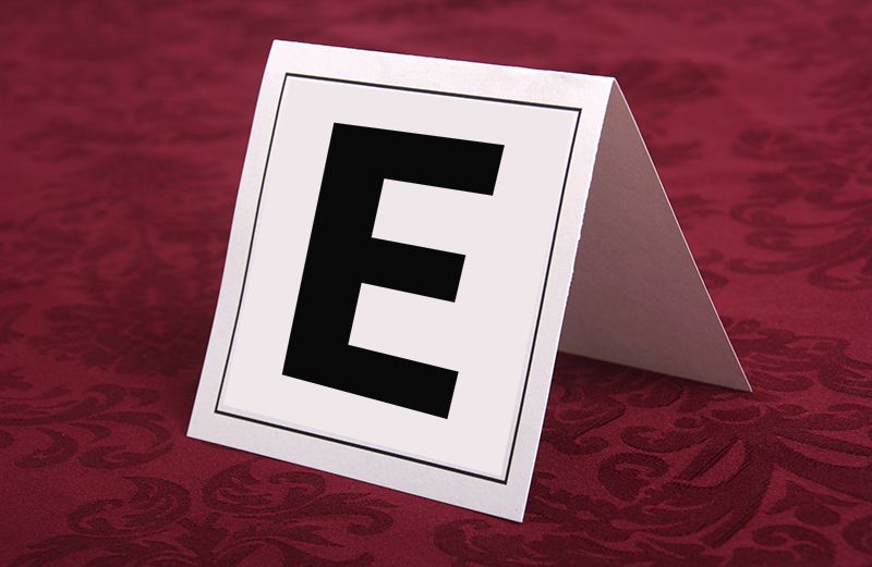 A table tent with a large E on it