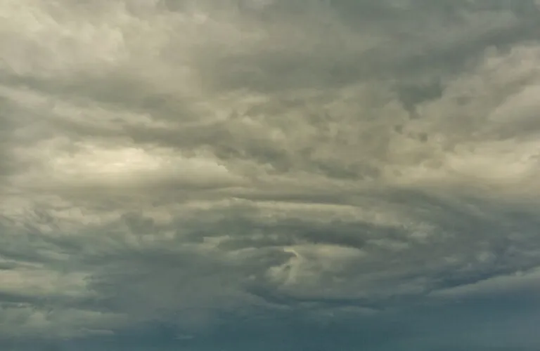 The eye of a menacing storm cloud
