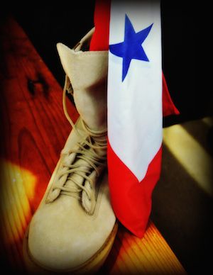 A boot pictured with a flag