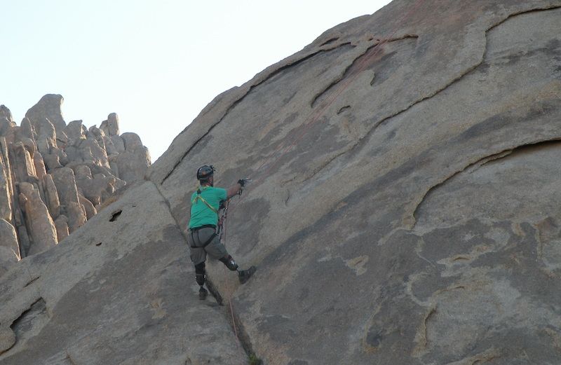 Cam Tribolet climbs a mountain.