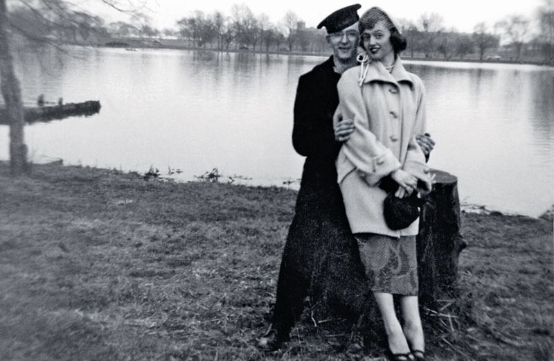 Susan's dad in uniform, posing by a lake with her mom