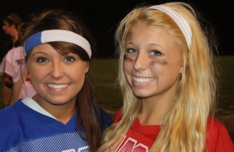 Michelle Adams's daughters in a Kodak moment at powder puff football game.