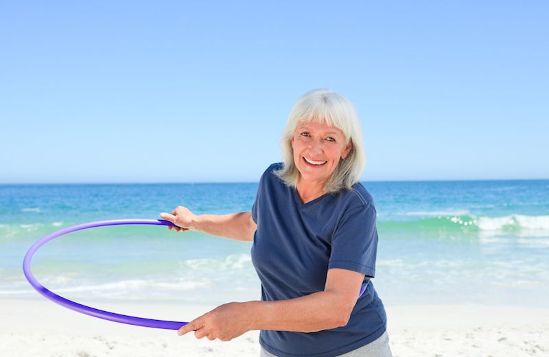 Photo of woman with hula hoop by Wavebreak Media for Thinkstock