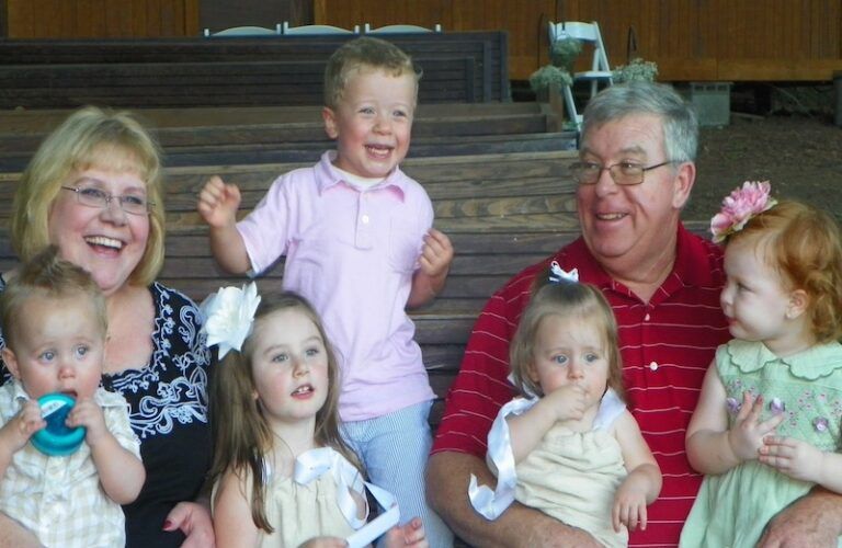 Michelle Cox with husband and grandchildren