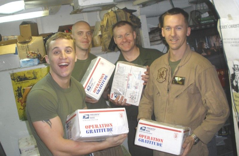 Photo of troops happily receiving care packages from Operation Rescue