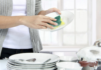 Serving while doing the dishes. Photo ferlistockphoto, Thinkstock.