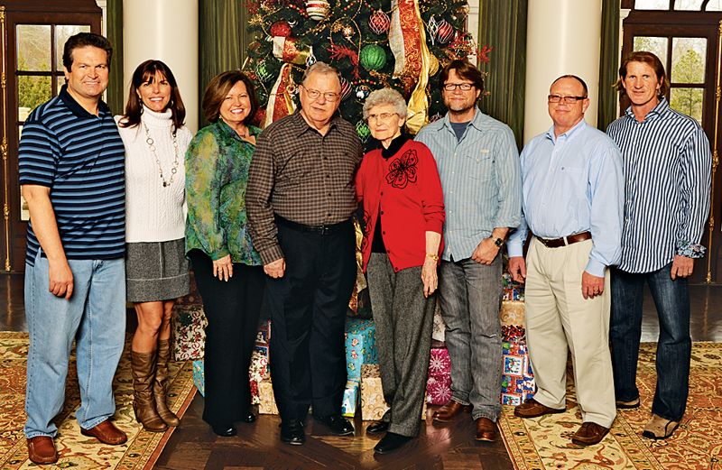 Rick and his family in 2012; his foster parents, the Prices, are in the center