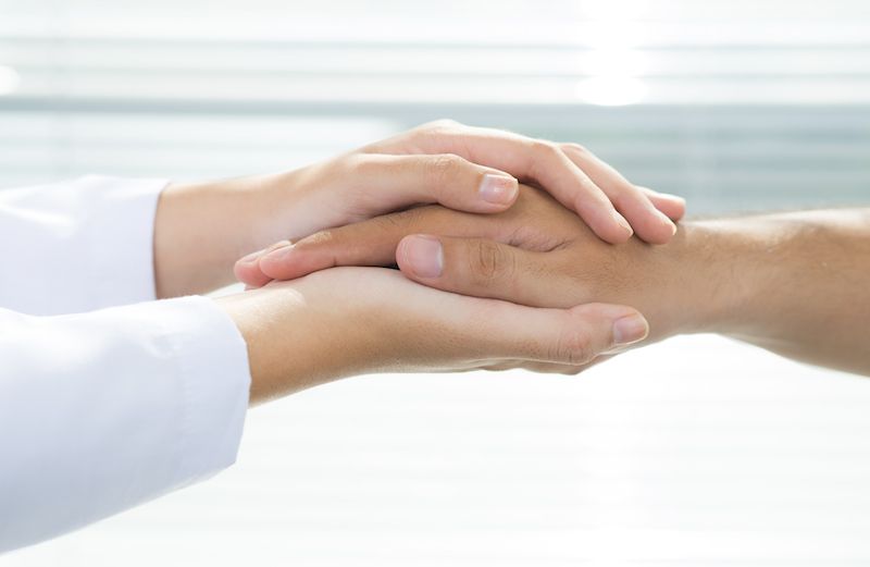 Helping someone who is ill. Photo by Dragon Images for Thinkstock, Getty Images.
