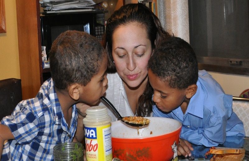 Karen Valentin and her two sons cooking dinner