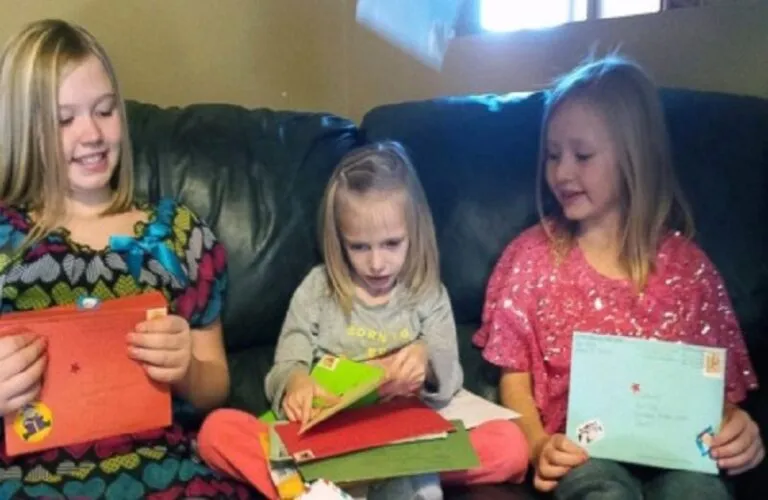 Addie reads her Christmas cards