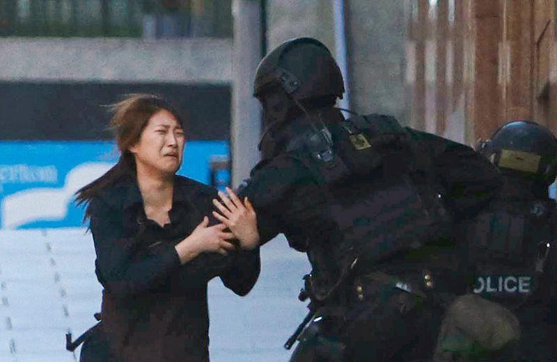 Australian hostage escapes into a policeman's arms