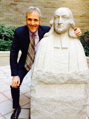 Rick Hamlin with statue of John Wesley