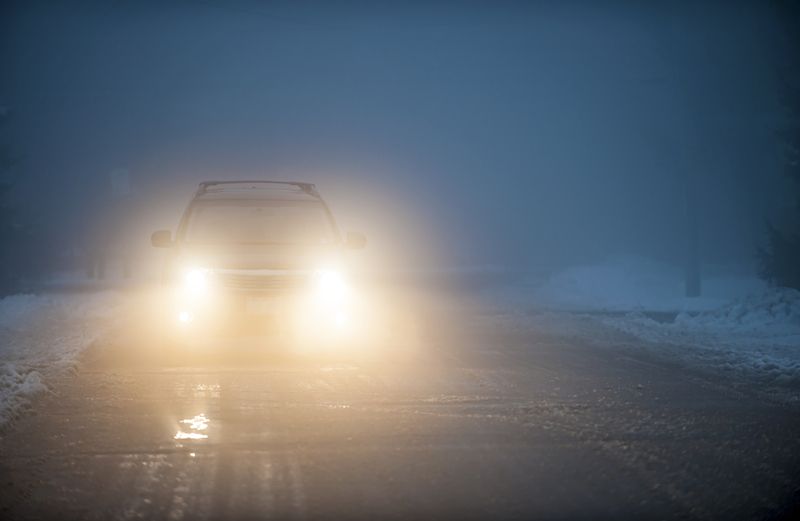 Headlights on a dangerous road. Photo by Elenathewise, Thinkstock.