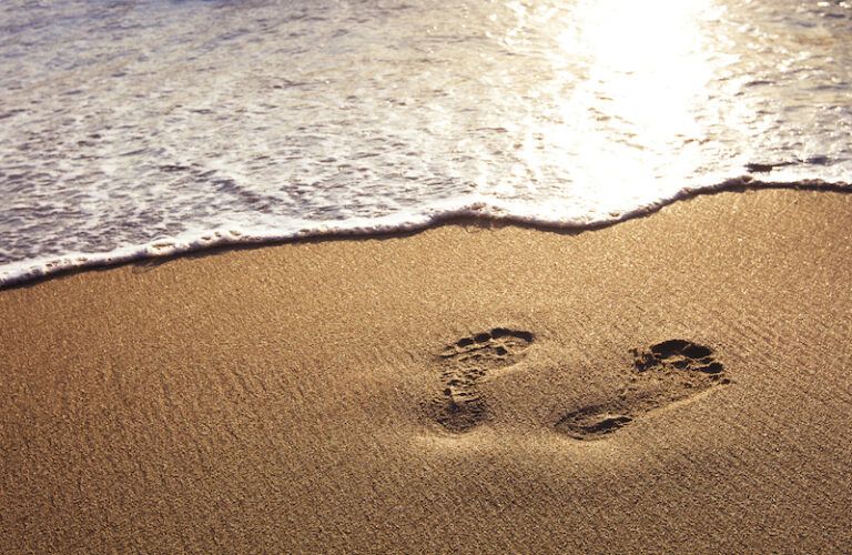 Footprints in the sand. Photo by Anya Berkut, Thinkstock.