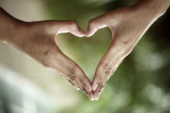 Hands forming a heart. Photo by Qpic Images, Thinkstock.