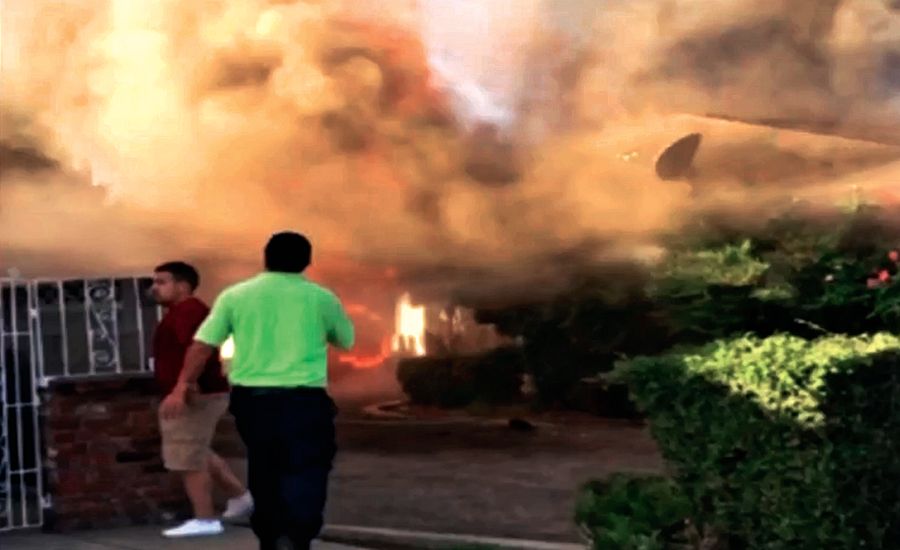 A screengrab from video taken of a house fire in Fresno, California