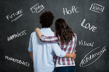 A young couple with arms around each other. Photo by Rido, Shutterstock.