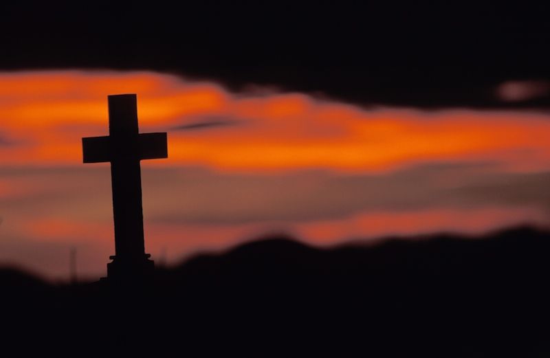 Cross at sunset. Photo by Ingram Publishing, Thinkstock.