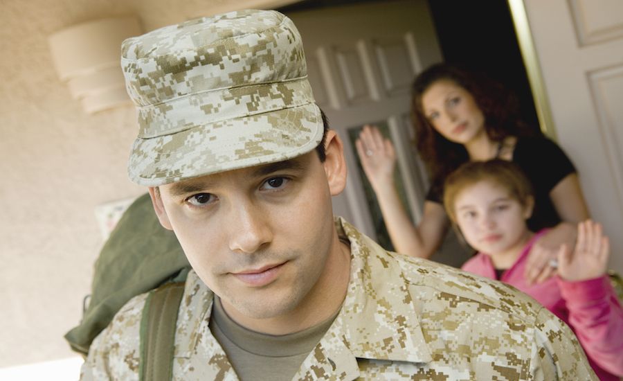 Soldier leaving home. Thinkstock.