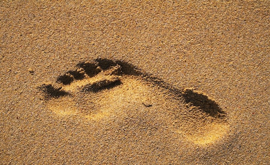 Footprint in the sand. Thinkstock.