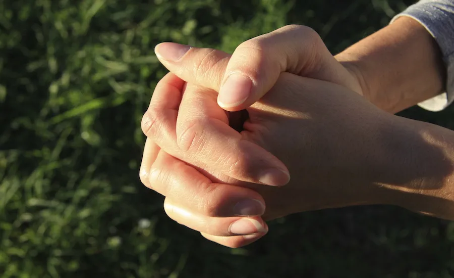 Hands clasped in prayer. Thinkstock.