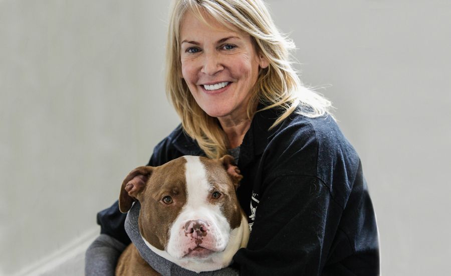 Tricia Montgomery, the founder of K9 Fit Club, with her current dog, Zeus