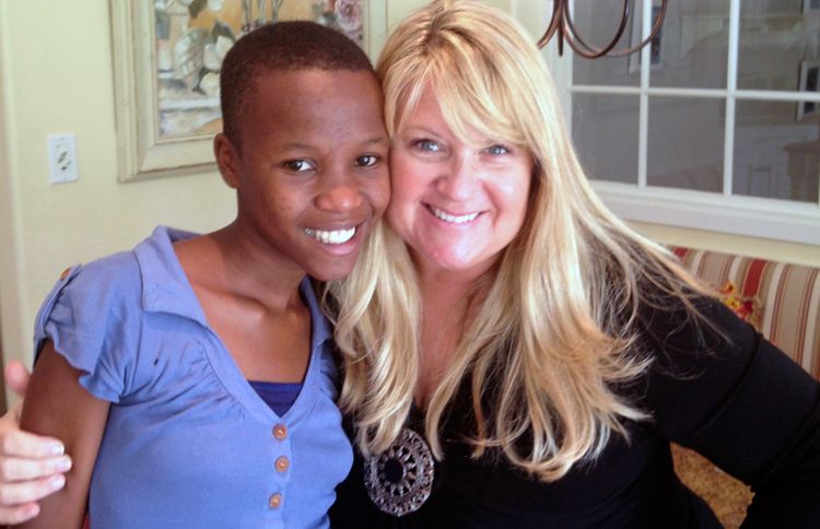 Shelene (right) and the child she sponsored, Omega, at Shelene's home in Los Angeles