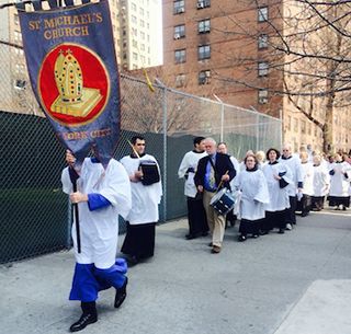 Members of the St. Michaels Church in walking their Palm Sunday parade on the streets of New York