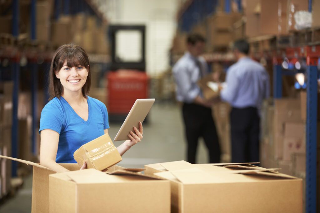 Warehouse worker with note pad. Thinkstock.