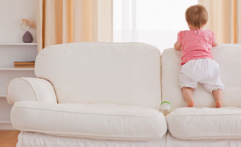 A baby standing. Photo: Thinkstock.