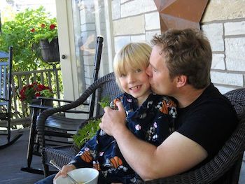 Father and son on the front porch.