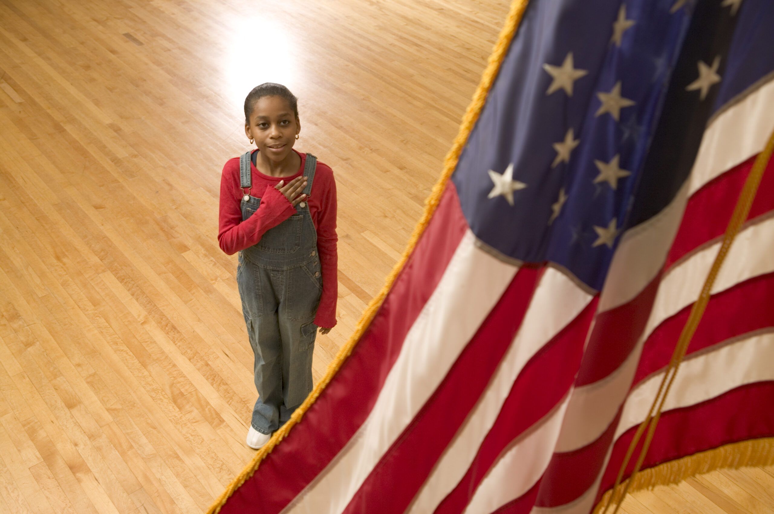Young Girl pledges allegiance to the American Flag