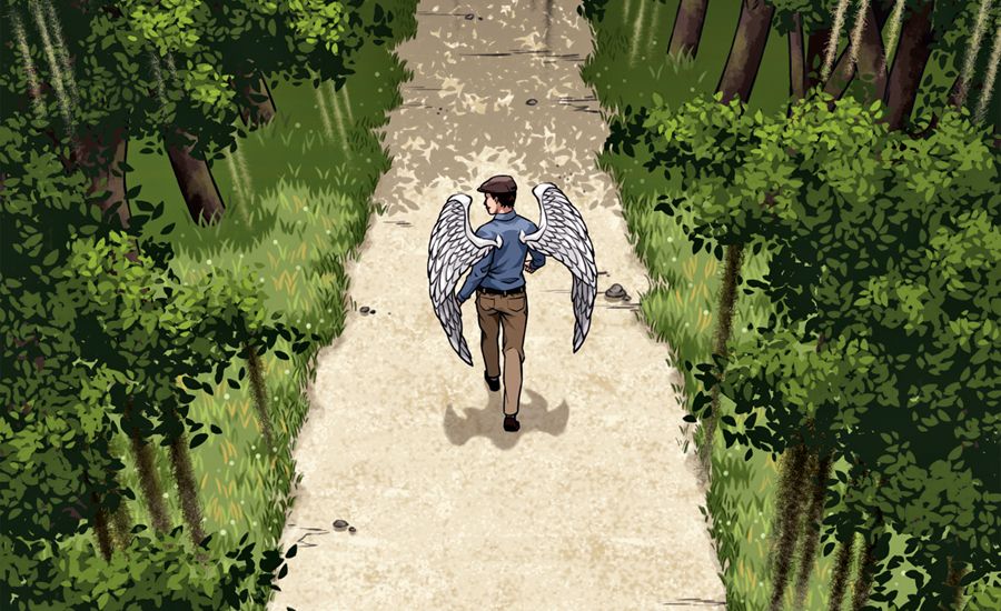 A young male angel walks along a wooded path.