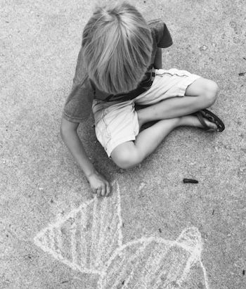 Shawnelle's son drawing with chalk in the driveway. A small moment of joy.