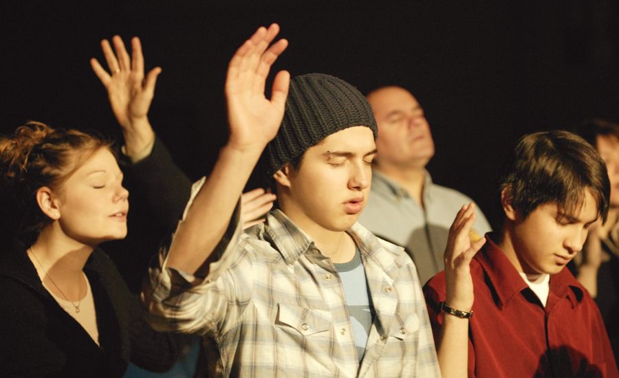 Teens praising God at church