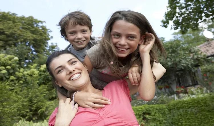 Mom and son and daughter playing. Author Amy Julia Becker learned 5 life lessons from her children.