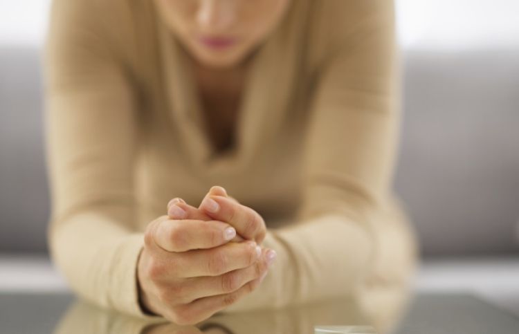 woman worrying and praying