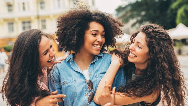 Three women friends outside together learning to be more grateful for each other