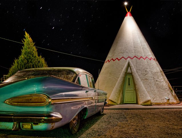 Guideposts: A vintage car parked outside one of the wigwam rooms at the Wigwam Motel in Holbrook, Arizona