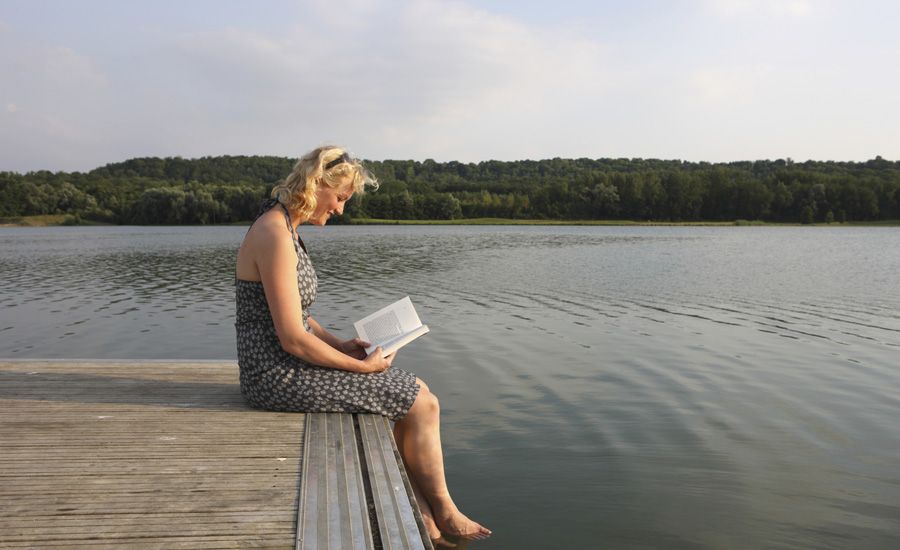 hear God's voice, a woman on a dock reading wonders how