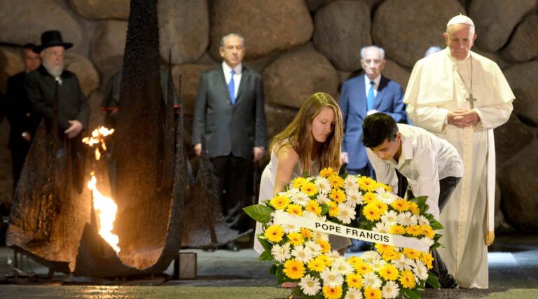 Children assist Pope Francis lay a wreath at the memorial tent of Yad Vashem, Israel's National Memorial and Museum of the Holocaust