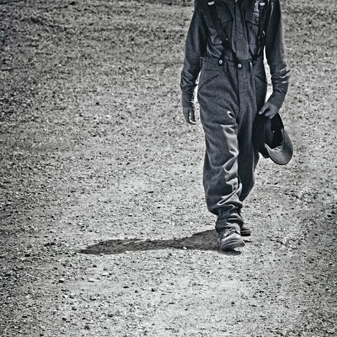 Guideposts: A World War II soldier walks along a dusty road.