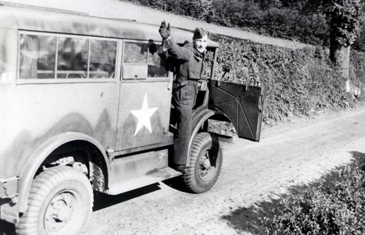 Guideposts: George Emmerson waves from the passenger seat of his army truck
