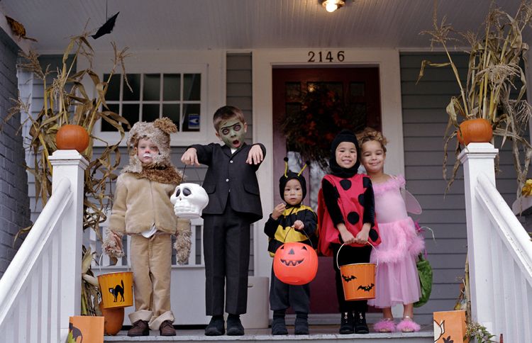 Guideposts: Five very cute trick-or-treaters smile at us from the porch of a welcoming home.