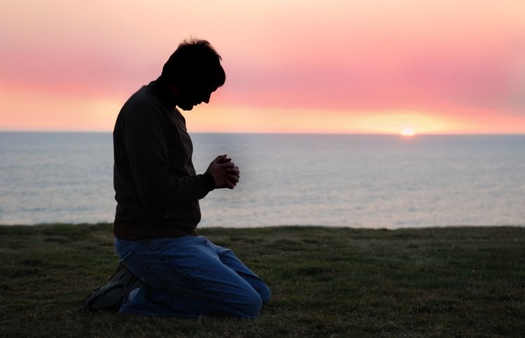 man praying during sunrise; discover the who, what, when and why of prayer