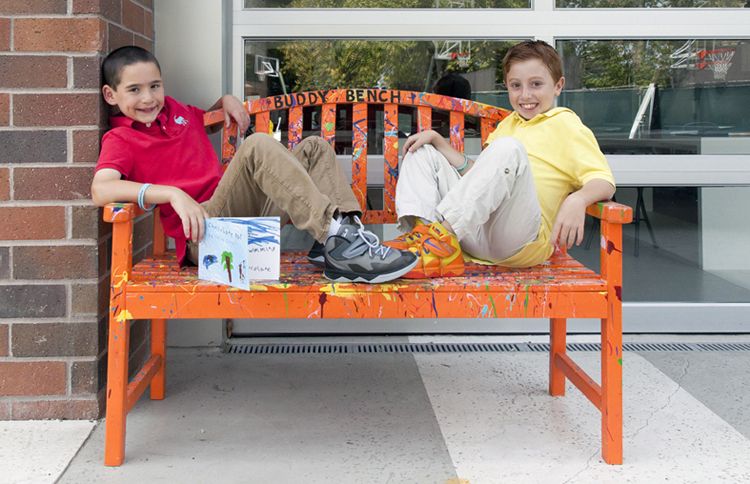 Guideposts: Jonah and Dylan relax on the Buddy Bench at school.