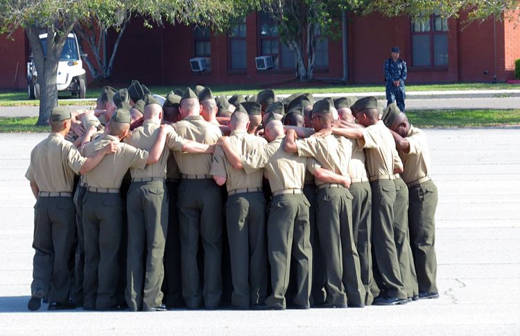 Guideposts: A platoon of Marines gather together for one final prayer after their graduation ceremony at the United States Marine Corp Military Training Base at Parris Island, SC.