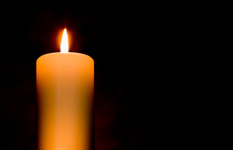Guideposts: A lit candle brighten a darkened room