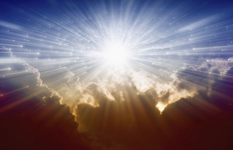 Guideposts: Heavenly beams of light from the sun peek out over the clouds
